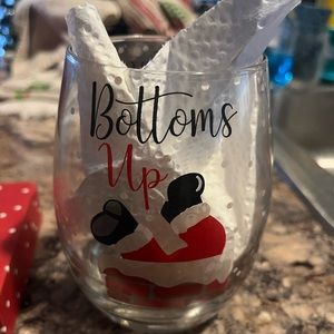 “Bottoms Up” stemless wine glass.